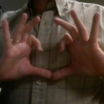 It's supposed to be a broken heart. Maybe it's a gang sign. Okay, new item: don't put gang signs on your dating profile.